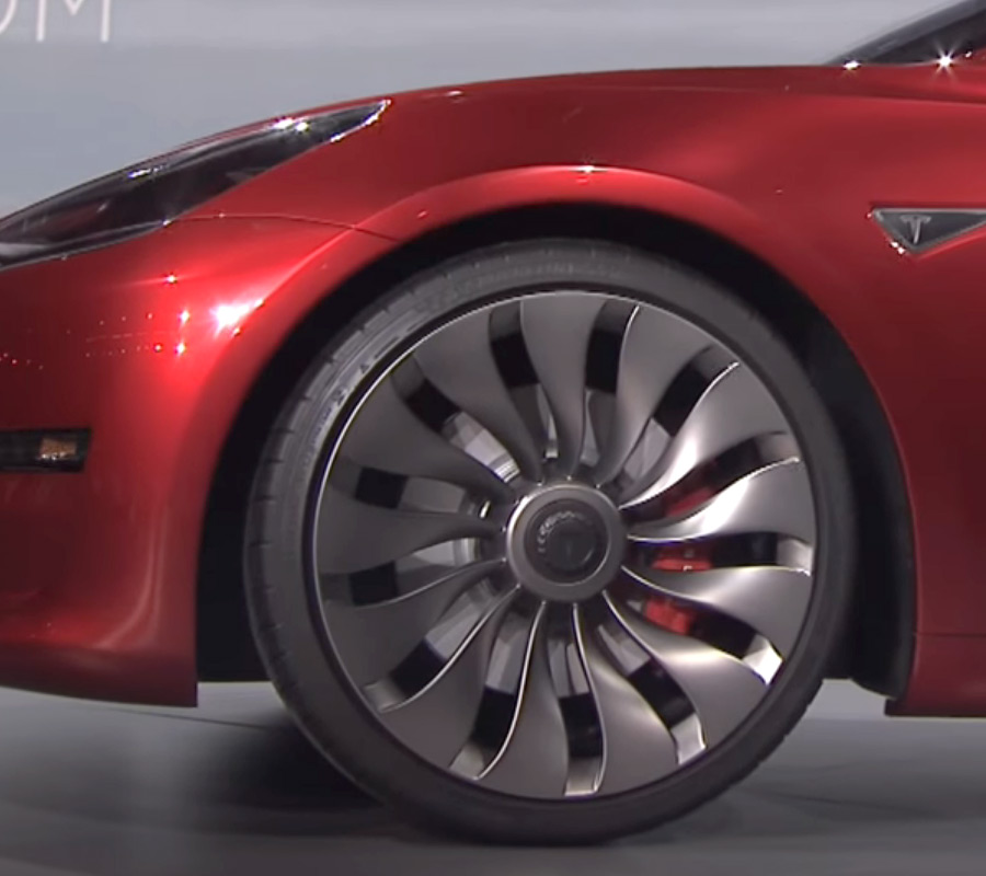 Red Tesla Model 3 with Wind-Turbine Wheels At The Unveil Event