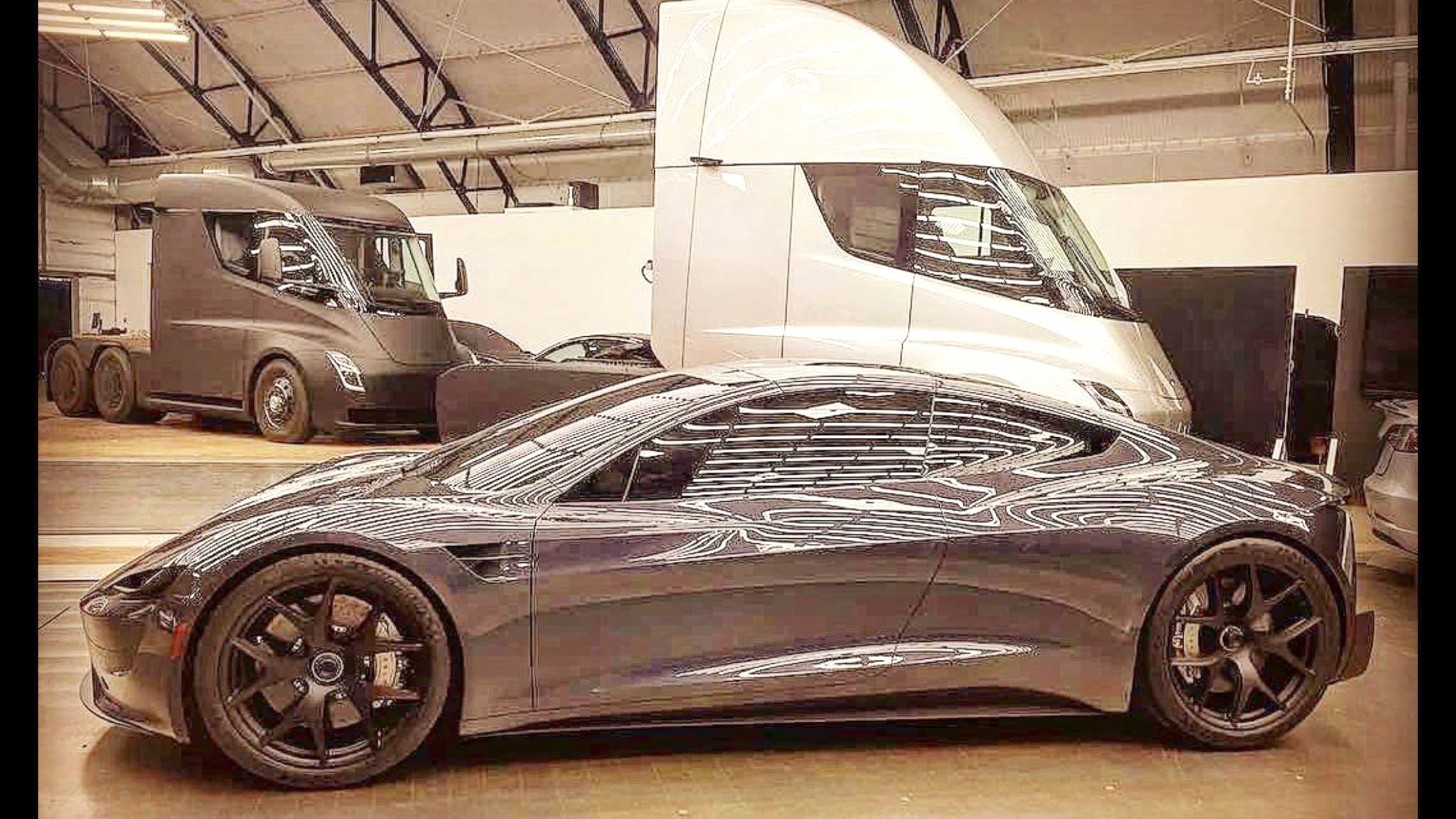 2019 Tesla Roadster leaked photo along with Tesla Semi trucks