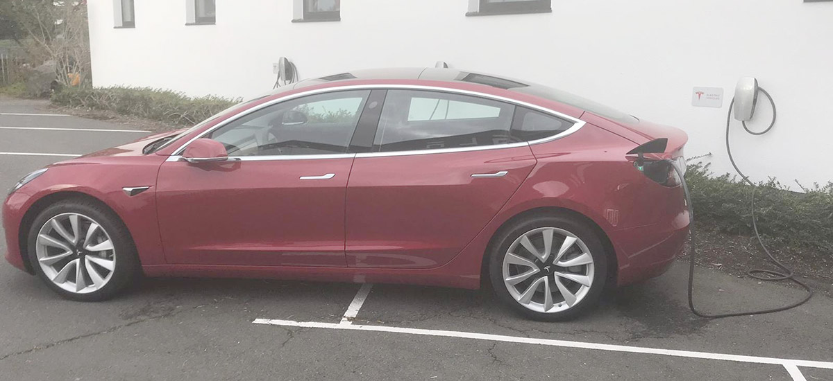 Model 3 spotted charging at Tesla Grohmann Germany