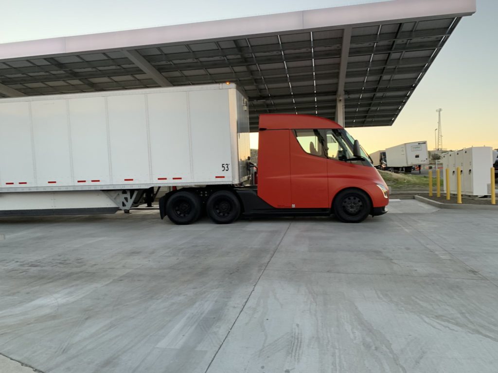 Red Tesla Semi Truck at Kettleman City Supercharger - Side View Zoom Out