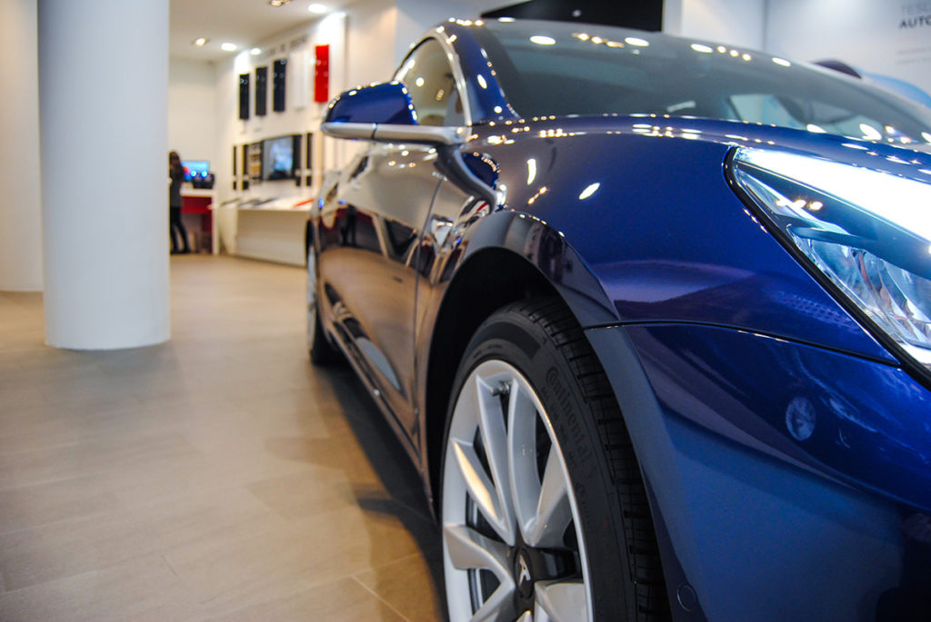 Blue Tesla Model 3 in Madrid, Spain - Front Partial Closeup