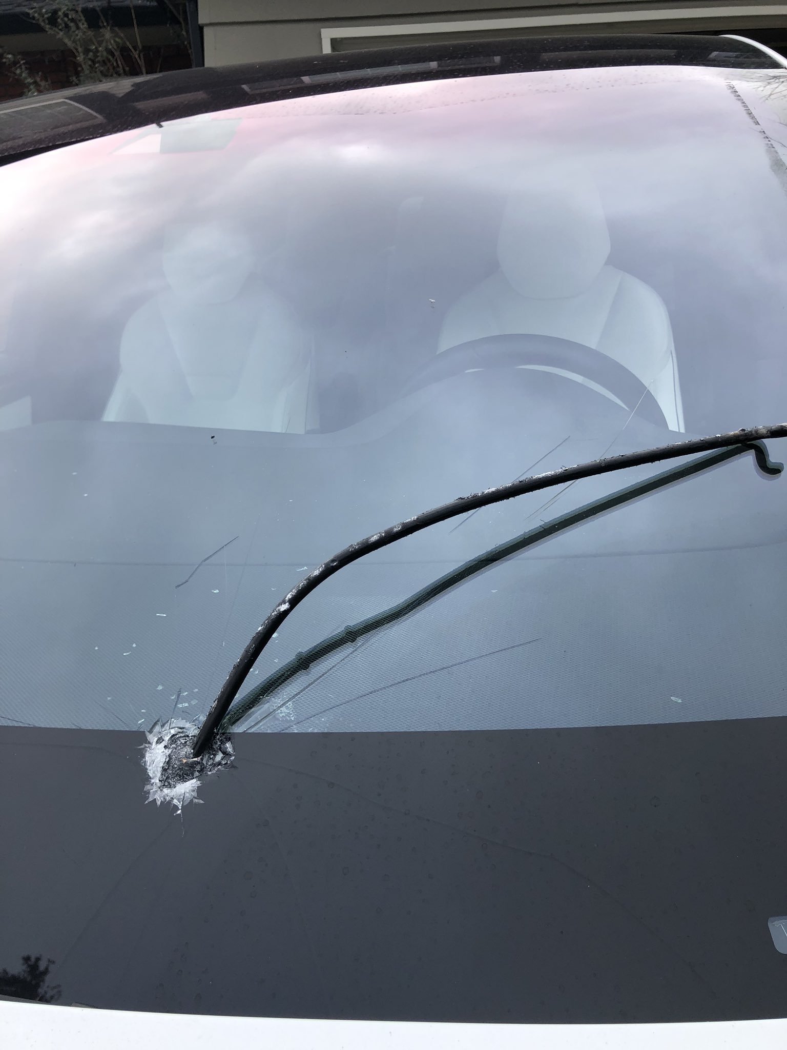 Tesla Model X hit by a flying steel rod.