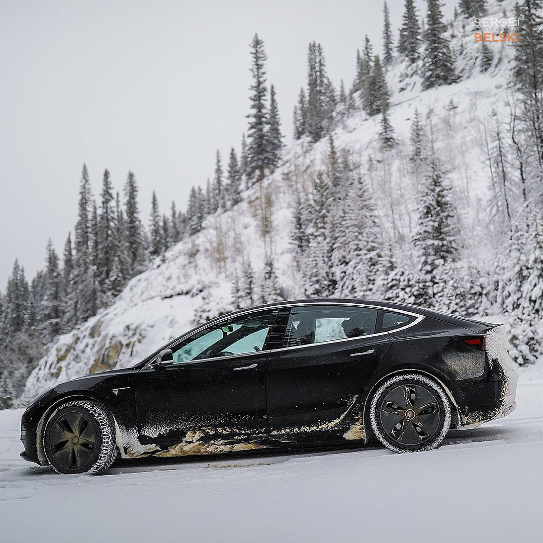 Black Tesla Model 3 in Snow - Side View
