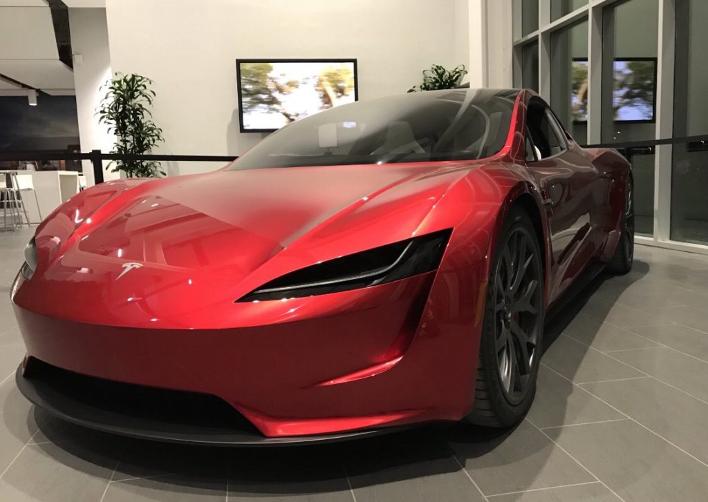 Next-gen Telsa Roadster in red color at a Tesla facility - front closeup