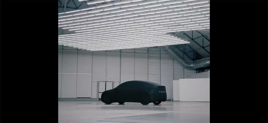 Tesla Model Y under cover teased just hours before the unveil