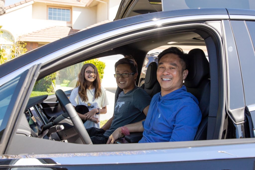 Happy Tesla customers receiving their cars via the Tesla Semi Truck