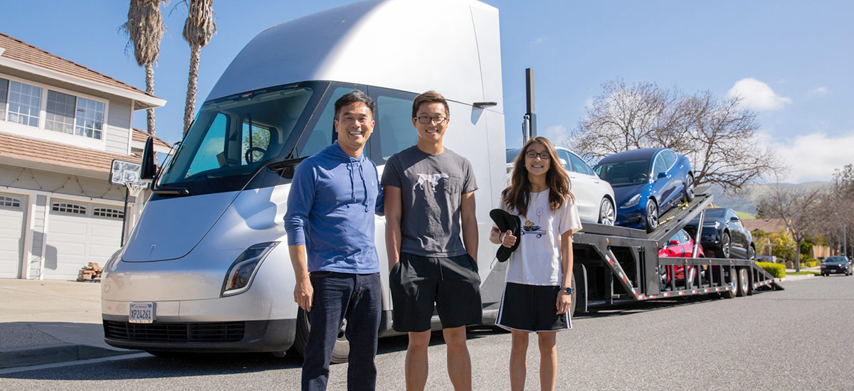 Tesla Semi Truck delivering cars to happy Tesla customers