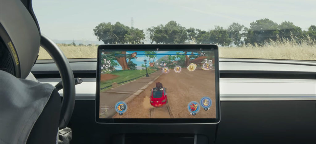 Playing Beach Buggy 2 video game in a Tesla Model 3
