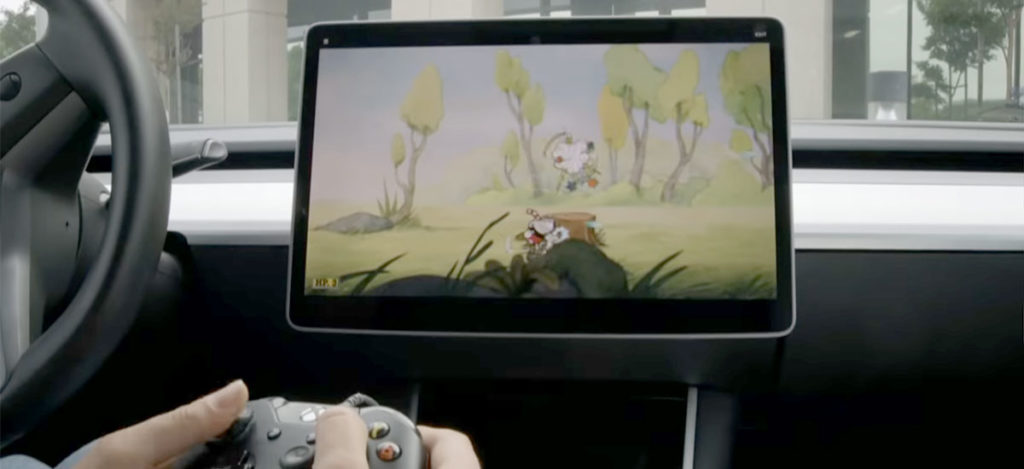 Playing Cuphead video game on a Tesla Model 3