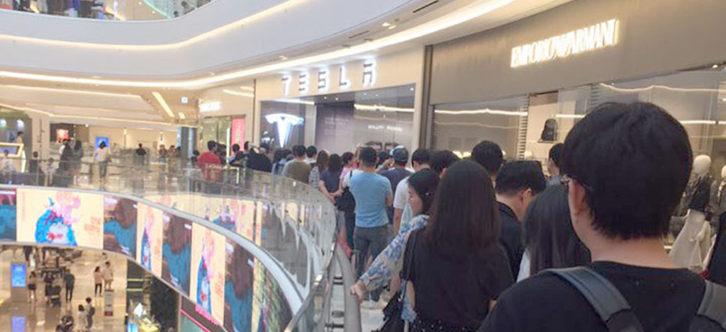Tesla Model 3 launched in South Korea, Tesla customers and enthusiasts rush towards the showrooms to get a glimpse.