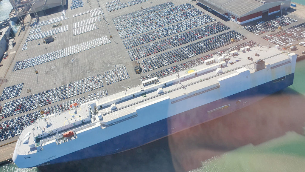 Aerial view of the Port of San Francisco Pier 80 showing thousands of Tesla Model 3s ready to be shipped.