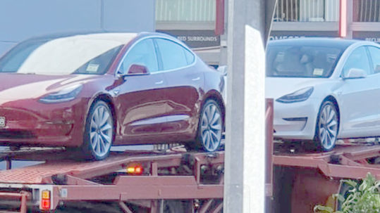 Tesla Model 3 electric vehicles arrive in Brisbane, soon to be followed by a ship loaded with cars for customers.