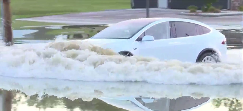Tesla Model X driving through the flood.