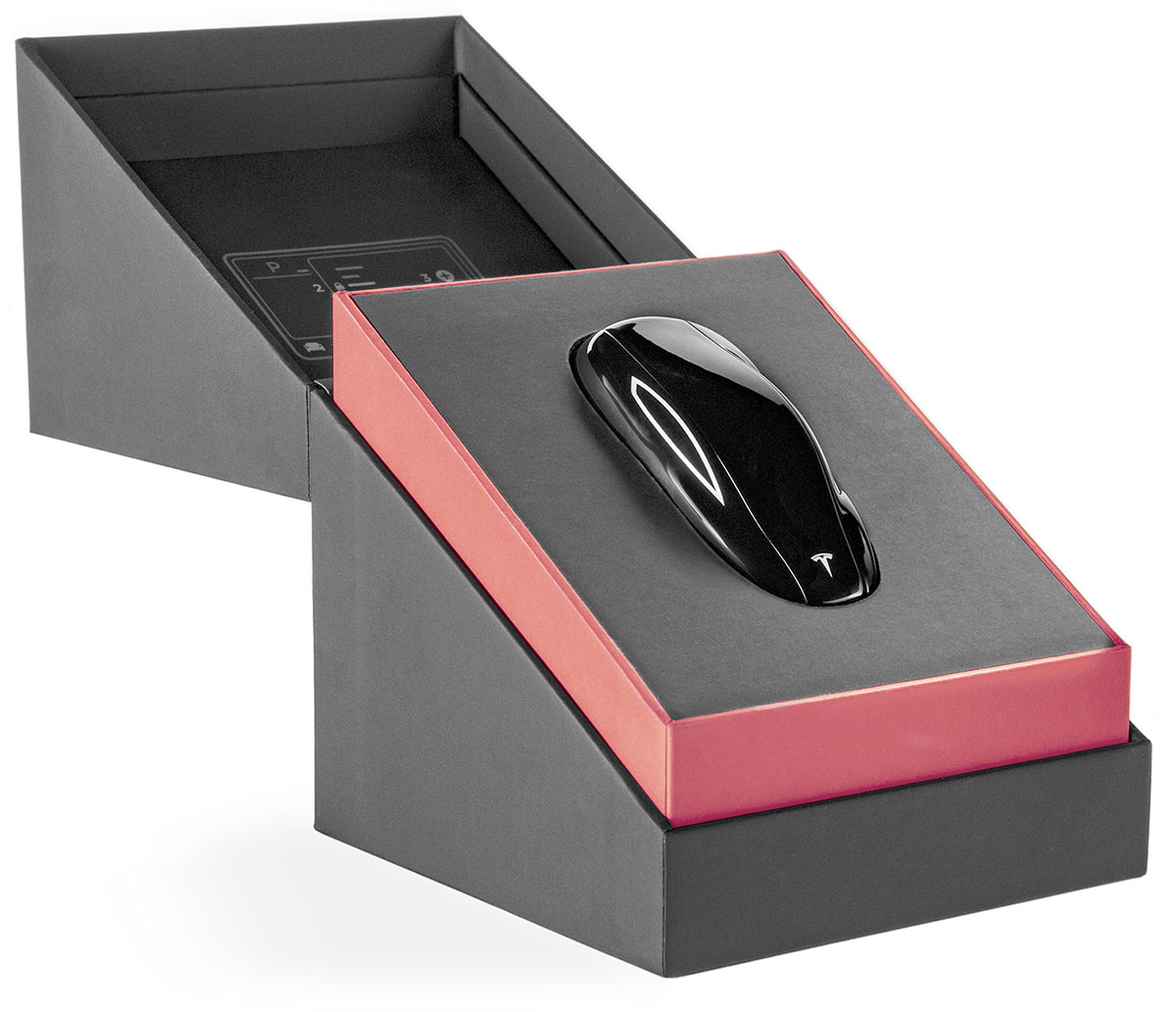 Tesla Model 3 key fob in its beautiful black and red opened box.