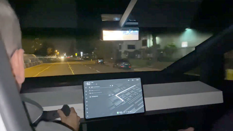 Tesla Cybertruck center touchscreen, rear-view camera display, square dashboard, Roadster type steering wheel.