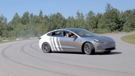 Tesla Model 3 drifting on the race track.