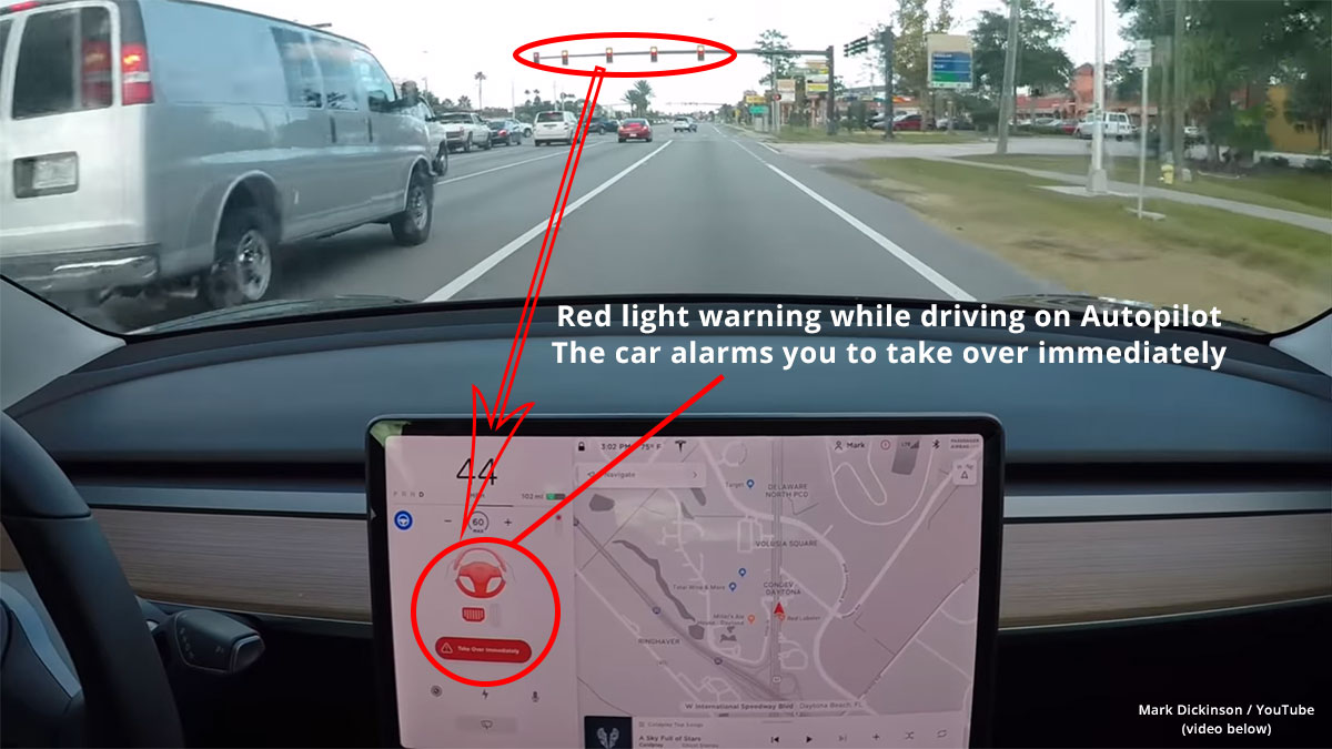 Autopilot on Tesla Model 3 detecting and warning for red stoplights.