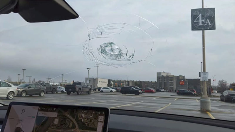 Condition of the Tesla Model 3 windshield after getting hit by the hammer (view from the inside).