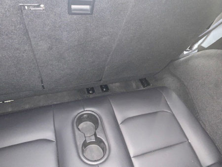 Rare look at Tesla Model Y 3rd row sets, it has cup holders too but knee space is minimum.