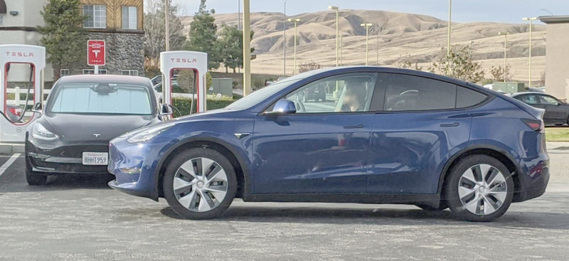 Tesla Model Y spotted at a Supercharger, Model 3 seen charging in the background.