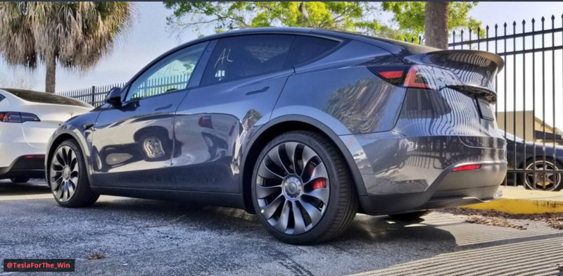 Tesla Model Y SUV in Midnight Silver Metallic (gray) color at the Tesla HQ delivery center.