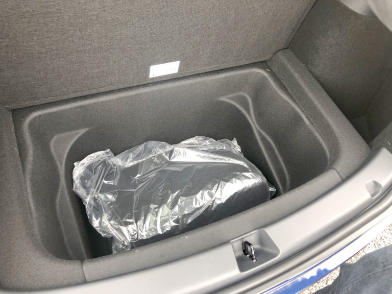 Tesla Model Y under trunk hidden compartment for extra luggage capacity.