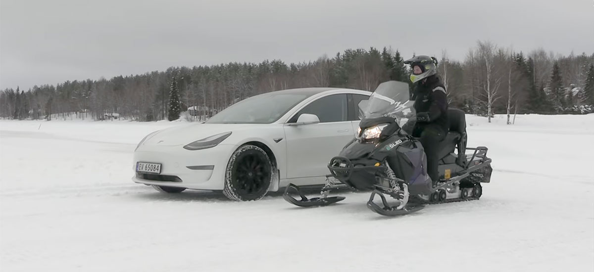 Tesla Model 3 vs. Snowmobile drag race.
